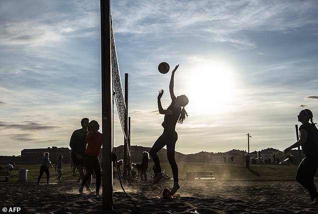 Sweden had a long-established plan for a pandemic and was going to stick to it. Pictured, people play beach volleyball at Gardet park amid the coronavirus outbreak in April